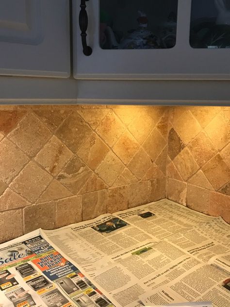 How I painted my travertine backsplash in three easy steps. Paint Tile Backsplash, Can You Paint Tile, Painting Tile Backsplash, Travertine Backsplash Kitchen, Travertine Tile Backsplash, Painting Kitchen Tiles, Slate Backsplash, Natural Stone Backsplash, Stone Tile Backsplash