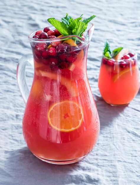 This Easy Festive Fruit Punch is perfect for entertaining during the busy holiday season! With a few simple ingredients, including sliced fruit and berries, you have a delicious beverage that will make a stunning presentation at your big Christmas party, or any celebration! #festivefruitpunch #punchrecipes #christmaspunch #christmasrecipes #glutenfreerecipes #veganrecipes #fruitpunch #christmaspunch #fruitpunchrecipe #punchrecipe Fruit Punch Recipe, Sliced Fruit, Raspberry Sherbet, Easy Punch, Homemade Food Gifts, Holiday Punch, Christmas Punch, Punch Recipe, Christmas Food Gifts