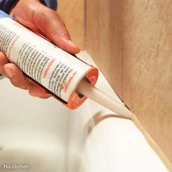 How to Caulk a Bathtub Tips (DIY) | Family Handyman Bathtub Caulking, Caulking Tips, Silicone Caulk, Family Handyman, Painters Tape, Close Up Photos, Masking Tape, Shopping Trip, Shower