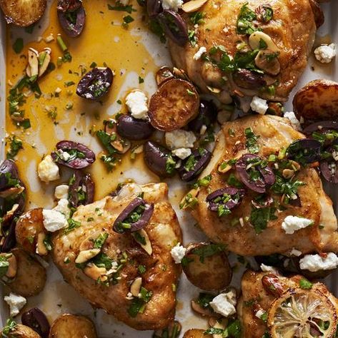 Sheet-Pan Roasted Lemony Chicken and Potatoes with Olive-Almond Sauce Lemon Chicken With Potatoes, Potatoes With Feta, Almond Sauce, Lemony Chicken, Chicken With Potatoes, Sheet Pan Meals Chicken, Cauliflower Pizza Crust Recipe, Pan Chicken Recipes, Halloumi Salad