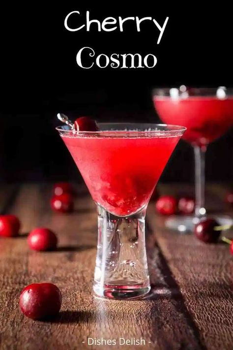 This Cherry Cosmo cocktail, which comes in a glorious red color that's easy on the eye, is super fun and oh so tasty! #cosmo #cherrycosmo #dishesdelish Cherry Martini Recipe, Cherry Vodka Drinks, Cherry Cocktail Recipes, Cherry Cocktails, Nonalcoholic Drinks, Cosmo Cocktail, Cherry Drink, Ginger Liqueur, Cherry Vodka