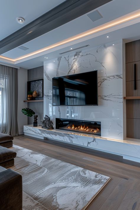 Revamp your living space with stylish fireplace wall ideas featuring a wall-mounted TV. Check out more ideas in this article. Tile Entertainment Wall, Modern House Design Interior Living Rooms Fireplaces, Giant Fireplace Family Rooms, Living Room Fireplace With Tv Modern, Linear Fireplace Marble, Fireplace Great Room Ideas, Linear Fireplace And Tv Wall Ideas, Faux Fireplace And Tv Wall, Media Wall No Fire