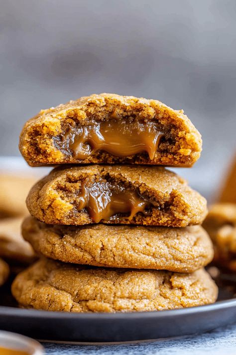 Caramel-Stuffed Pumpkin Cookies are delightfully chewy, bursting with rich pumpkin flavor, and perfect for welcoming the fall season. These cookies, although indulgent, are surprisingly simple to prepare. Embrace the essence of the harvest with a pumpkin twist and indulge your sweet cravings! As you bake these cookies, your home will be enveloped in the warm, Stuffed Pumpkin Cookies, Caramel Stuffed Pumpkin Cookies, Easy Thanksgiving Cookies, Skillet Pan, Pecan Cookies, Thanksgiving Cookies, Caramel Candy, Caramel Cookies, Ginger Cookies