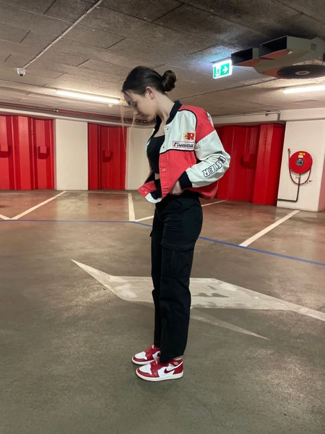 Red Jordan 1 outfit, OOTD, vibes, photo inspo, outfit inspo, clothes, racer jacket, cargos outfit, outfit ideas, jordan 1 outfit ideas, parking garage pinterest, f1 Jordan 1 Lows Outfit Women, Red Jordans Outfit For Women, Red Jordan 1 Outfit, Parking Garage Aesthetic, Outfit Ideas With Jordans, Red Sneakers Outfit, Jordan Outfits Womens, Black Shoes Outfit, Black Jacket Outfit