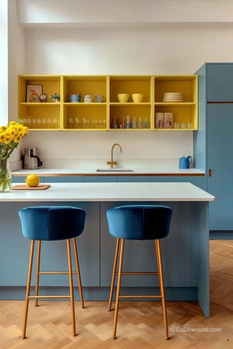 This modern vibrant kitchen can’t help but make you cheerful with its design. Yellow is complementary to blue, so it’s only natural that it works so well in this space Blue Yellow Kitchens, Kitchen Color Yellow, Blue Kitchen Designs, Vibrant Kitchen, Materials Board Interior Design, Kitchen Design Small Space, Beautiful Kitchen Designs, Accent Storage, Ideas For Small Spaces