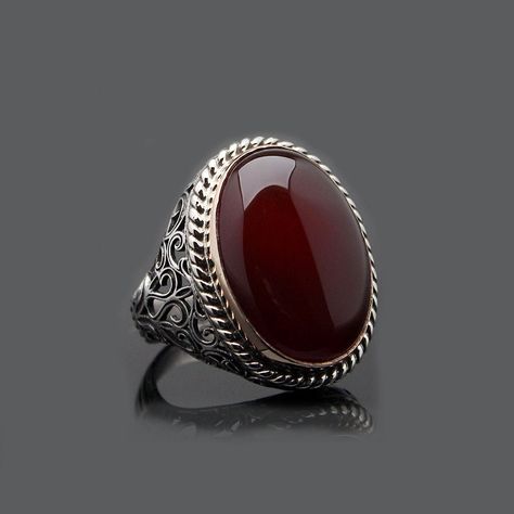 Red Yemeni Agate Aqeeq Oval Silver Ring. Handmade in 925 sterling silver with agate stone. On the ring oval red agate - aqeeq stone settled. Sides has elegance ornaments. Dimensions of stone is 18 mm x 25 mm. Average weight of Red Yemeni Agate Aqeeq Oval Silver Ring is 20 gr. (depends your ring size). Classic and exclusive style.  Stone Type: Yemeni Agate - Aqeeq Stone Color: Red Stone Dimensions: 18 mm x 25 mm Stone Shape: Oval Average Weight: 20 gr. Made in Istanbul, Turkey. Need 3-6 days to p Aqeeq Stone Ring For Men, Silver For Men, Pearl Rings Vintage, Jewelry Knowledge, Silver Handmade Jewelry, Artisan Rings, Bride Jewelry, Average Weight, Red Agate