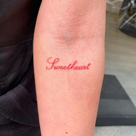 Red Ink Quote Tattoo, Love Looks Pretty On You, Lover Word Tattoo, Lovely Tattoo Word, Lover Girl Tattoo, Short Phrases Tattoo, Word Tramp Stamp, Pretty Tattoo Fonts, Lover Tattoo Word