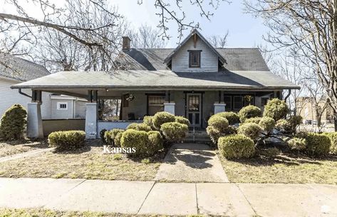 Under $100K Sunday - Circa 1900 Kansas Bungalow For Sale $90K - In a Time Capsule - Old Houses Under $50K Old Houses For Sale, Cast Iron Radiators, Bungalows For Sale, Kitchen Cupboard, Large Living Room, Kitchen Cupboards, Time Capsule, Formal Dining Room, Porch Swing