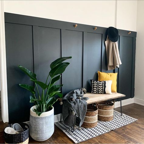 Integrate style and character into your entryway with this black board and batten wainscoting. The dark hues beautifully complement the neutral farmhouse dÃ©cor. Employ rich natural flooring with lush green colors provided by a cute house plant to complete this beautiful setting. French Country Entryway Ideas, Brick Entryway, Black Board And Batten, Entryway Bench Ideas, Small Entryway Bench, Entryway Hooks, Narrow Entryway, Board And Batten Wall, Farmhouse Entryway