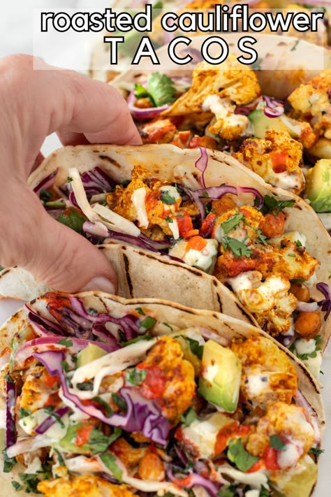 Quick and easy roasted cauliflower and chickpea tacos with crunchy slaw and creamy avocado. Ready in 20 minutes, everyone loves this vegan taco recipe! Vegan Cauliflower Tacos Recipes, Greek Cauliflower Tacos, Chickpea Tacos Recipes, Chickpeas Tacos, Cauliflower Tacos Recipes, Cauliflower Tacos Vegan, Vegetarian Taco Recipes, Roasted Cauliflower Chickpea, Vegan Cauliflower Tacos