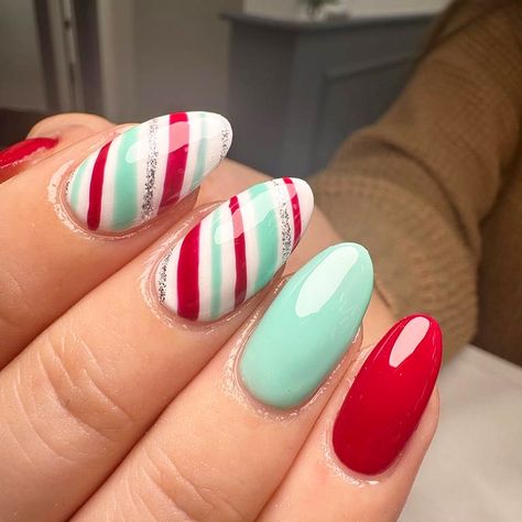 Candy cane dreams 🍭 By India 🥰🤤 #nails #gelnails #nailart #nailsofinstagram #christmasnails #worthing #worthingnails #westsussex… | Instagram Christmas Day Nails, Christmas Nail Candy Cane, Red Christmas Nails Candy Canes, Christmas Candy Nail Art, Candy Cane Pedicure, Red And Green Christmas Nails Holidays, Green And Pink Christmas Nails, Blue Candy Cane Nails, Christmas Nails Fun