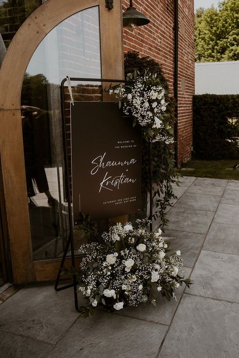 Black White Welcome Sign Greenery Flowers Classic Barn Wedding Firewood Film #wedding #weddingsign White And Black Welcome Sign, Modern Barn Wedding Decor, Black And White Wedding Welcome Sign, Black And White Wedding With Greenery, Black Wedding Signage, Black And White Barn Wedding, Welcome Sign Wedding Flowers, Black And White Welcome Sign, Black And White Wedding Ceremony