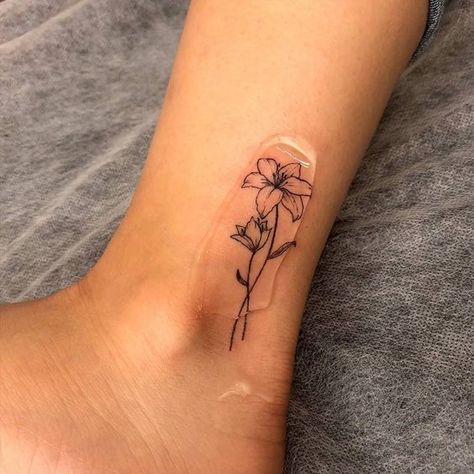 Fine Ankle Tattoo, Lily Flower Tattoos Ankle, Lily Flower Line Tattoo, Dainty Lilly Tattoo, Lily Flower Tattoos Behind Ear, Fine Line Flower Tattoo Matching, May Lilly Tattoo, May Lilly Flower Tattoo, Micro Lily Tattoo