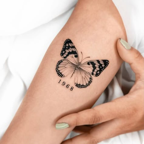 Birth Year Butterfly Tattoo, Butterfly And Year Tattoo, Butterfly With Marigold Tattoo, 11:11 Tattoo With Butterfly, Butterfly Tattoo With Birth Year, Butterfly Tattoo With Year, Butterfly Gemini Tattoo, Bigger Tattoos For Women, Butterfly With Date Tattoo