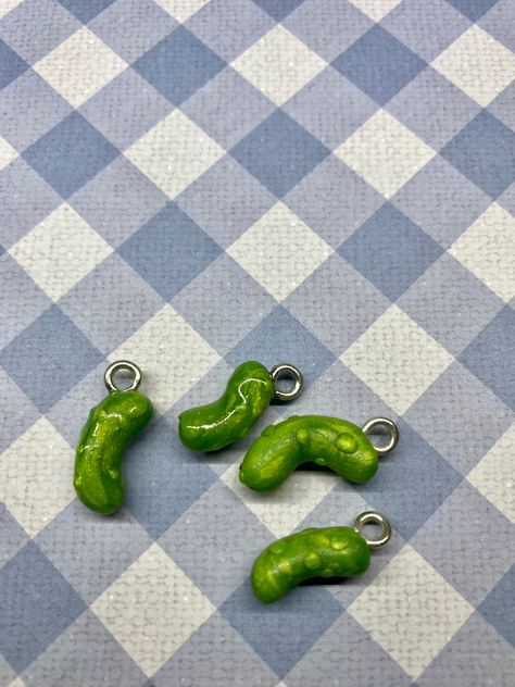 Ise this charm to customize your own jewelry! #thatweirdartgirl #customjewelrydesign #pickle #picklecharm #claycharm Pickle Keychain, Clay Pickle, Polymer Clay Pickle Earrings, Pickle Jewelry, Pickle Rick Keychain, Pickle Tumbler Cups, Clay Magnets, Clay Stuff, Clay Figures