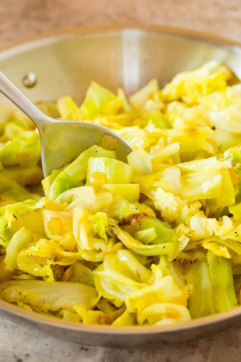 This sauteed cabbage is coarsely chopped green cabbage cooked with butter, onions, garlic and fresh herbs. An easy and inexpensive side dish that pairs well with chicken, steak and pork. Boil Cabbage Recipe, Quick Sauerkraut, Stewed Cabbage, Cabbage Steaks Recipe, Boiled Cabbage, Buttered Cabbage, Cabbage Stew, Sauerkraut Recipe, Baked Cabbage