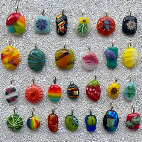 "Handmade fused glass pendants. Large range of colours, sizes and styles to choose from. There's dichroic glass, swirls, strawberries, flowers, rainbows, even a little sugar skull!  Made by layering small layers of glass on top of each other then they've been fused together in our kiln.  All pendants are one of a kind and unique. These pendants are made from recycled glass.  Come without chain / necklace. There's options for a chain to be added - there's a choice of 18\" silver plated chain or 18\" (extends up to 20\") black cord. Sizes vary. The largest is number 32 which measures 3cm x 2cm and the smallest is number 55 which measures 1.5cm x1.2cm. Please choose a colour / option from photos. Pendant numbers can be found on last few photographs. ❤️" Small Layers, Fusing Glas, Fused Glass Necklace, Abstract Pendant, Dichroic Glass Pendant, Fused Glass Pendant, Fused Glass Jewelry, Necklace Unique, Fused Glass Art