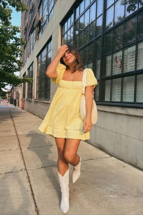 We’re loving the limoncello shade of yellow for our summer outfits! Pair your favorite cowboy boots with a soft yellow mini dress. Dress And Cowboy Boots, Yellow Dress Outfit, Cowboy Boot Outfits, Dresses With Cowboy Boots, Sunkissed Skin, Yellow Mini Dress, Summer Shades, Country Concert Outfit, Yellow Outfit