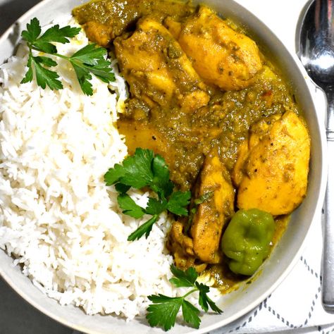 This curry chicken from the Caribbean island country of Trinidad hits close to home. Curry powder and fresh herbs and aromatics in their green seasoning form the base of this super simple chicken affair. Trinidad And Tobago Recipes, Trinidad Dishes, Trinidad Curry Chicken, Trinidad Curry, Trinidadian Food, Trini Recipes, Caribbean Kitchen, Trinidad Food, Green Seasoning