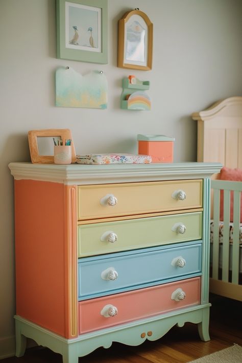 colorful dresser for rainbow themed nursery Rainbow Themed Playroom, Pastel Girl Nursery, Girl Nursery Ideas Colorful, Nursery Ideas Unique, Colorful Girl Nursery, Rainbow Nursery Ideas, Colorful Baby Room, Painted Nursery Furniture, Rainbow Baby Room