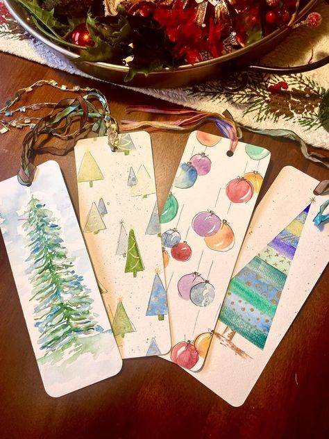 Watercolor Tutorials for Beginners | A few more festive holiday bookmarks | Facebook Watercolor Paintings Bookmarks, Bookmark Watercolor Ideas, Hand Painted Bookmarks, Holiday Bookmarks, Christmas Watercolors, Paintings Tutorials, Learn Watercolor Painting, Ideas Navideñas, Christmas Bookmarks