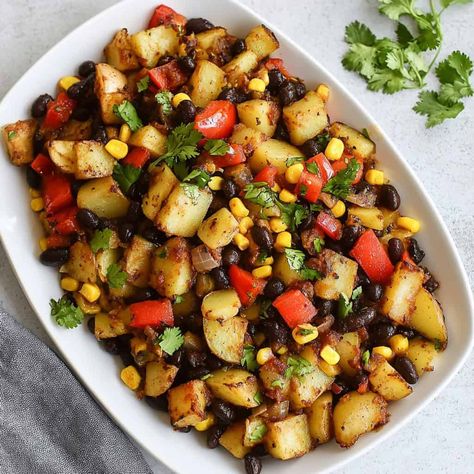 Black Bean and Corn Hash A hearty vegetarian hash made with black beans, corn, potatoes, and red bell peppers, garnished with fresh cilantro. Hash Recipes, Breakfast Hash Recipes, Greek Breakfast, Steak Breakfast, Black Bean And Corn, Black Beans Corn, Black Bean Recipes, Hash Recipe, Red Bell Peppers