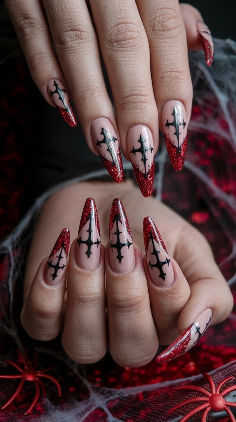 Make a bold statement this Halloween with these stunning acrylic nails! Featuring a sleek beige base adorned with vibrant red glitter and intricate cross wing designs, these nails blend elegance with a hint of edginess. Perfect for the stylishly spooky! #halloweennails #halloweenvibe #nailsdesign #acrylicnails #nailsinspo #octobernails Bold Halloween Nails, Gothic Christmas Nails Simple, Simple Goth Nails Coffin, Goth Medium Nails, Spooky Holiday Nails, Dark Goth Nail Designs, Almond Nails Alternative, Gothic Nail Designs Short, Nails Design With Cross