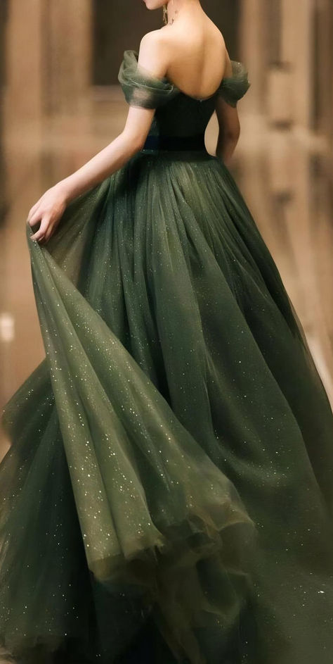 Discover the perfect dark green evening gown for your next black-tie event. This elegant off-shoulder dress, with its flowing tulle and subtle sparkle, is designed to make you feel confident and look stunning. Ideal for galas, formal events, or any occasion where you want to leave a lasting impression. Explore more styles that capture timeless beauty and whimsical fairytale fairycore enchanted fairy fantasy grace. Goblincore Prom Dress, Forest Theme Prom Dress, Green Prom Dress Ballgown, Like Green Dress, Fairytale Prom Dresses, Green Ball Gown Princesses, Ball Dresses Green, Forest Prom Dress, Earthy Prom Dress