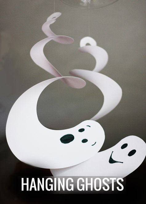 Ready for a really easy Halloween decor with high impact? Let's make some  Halloween Hanging Ghosts. These are an awesome addition to your party and  interior decorations for the season.  Inspired by these twirling spiral ghosts, I created these ghoulish  creatures that are now hanging from chandeliers and pendants all over our  house.  I love how simple they are to create from cardstock, scrapbook paper, or  posterboard. You need something that will give you extra weight so that  gravity can... Strašidelný Halloween, Halloween Hanging Ghost, Dekorasi Halloween, Halloween Infantil, Ghost Crafts, Labu Halloween, Snowflake Patterns, Halloween Fest, Image Halloween