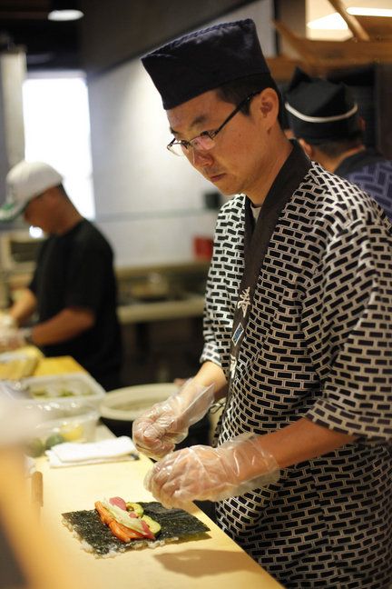 Traditionally, a sushi chef or itamae trains for 10 years before serving this Japanese food in a restaurant. Sushi Chef Uniform, Japanese Chef Uniform, Sushi Halloween Costume, Cooking Sushi, Chef Dress, Chef Design, Japanese Restaurant Design, Noodle Bar, Man Cooking