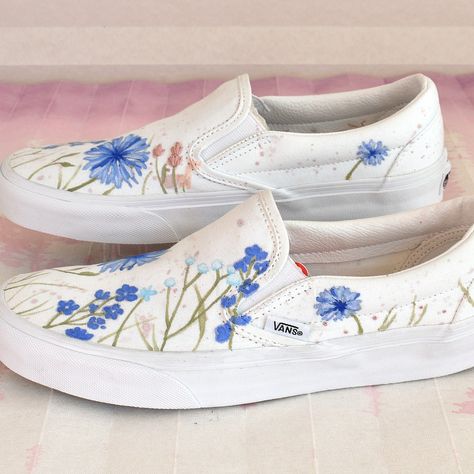 Hand painted Vans Classic slip ons, with embroidered details. A bride-to-be asked me to paint these in her wedding color palette, and I'm so grateful that she did 😊🙏 People usually ask me to paint most of the available area - these are more minimal, with a clean look. I love how they turned out 😍. What do you prefer? A mostly minimal aesthetic, or a fuller maximalist one? Let me know in the comments 🌸 #customsneakers #weddingsneakers #somethingblue #customvans #handpaintedshoes #paintedvans Bride Vans, Painted Vans Slip On, Vans Flowers, Hand Painted Vans, Embroidered Vans, Painted Shoes Diy, Vans Classic Slip, Painted Vans, Wedding Sneakers