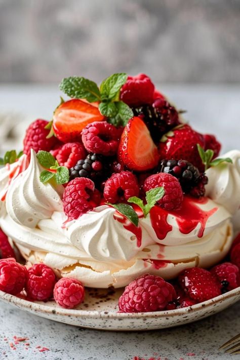 Berry Pavlova is a delicious and nutritious choice for any mealtime! 🍓🍇 Made with a crisp meringue shell and topped with a medley of fresh berries, this dessert is a delightful blend of sweet flavors and airy texture. Quick to prepare and bursting with fruity goodness, Berry Pavlova is perfect for a refreshing dessert or special treat. 😋🍰 #BerryPavlova #HealthyEating #DeliciousDesserts #FruityFlavors #SweetTreats #BakingLove #LightAndAiry Pavlova Food Photography, Pavlova Toppings, Fruit Pavlova, Berry Pavlova, Pavlova Cake, Meringue Pavlova, Mini Pavlova, Delicious Seafood Recipes, Beautiful Cake Stands