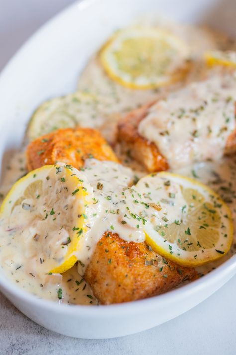 Oven Baked Salmon With Creamy Lemon Garlic Sauce Mahi Recipes Baked, Mahi Mahi Recipes Baked Ovens, Baked Mahi Mahi Recipes, Mahi Mahi Recipes Baked, Creamy Lemon Garlic Sauce, Mahi Recipes, Baked Mahi Mahi, Easy Fish Dinners, Parmesan Crusted Salmon