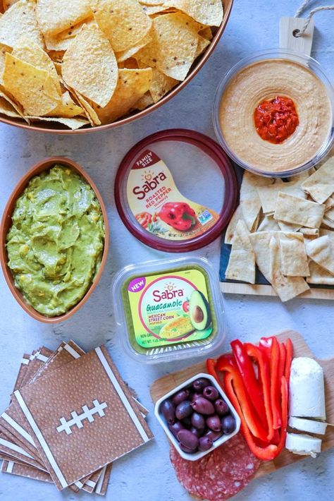 I’m sharing an epic game day snack board with fun hummus pairings. This charcuterie board with hummus is delicious for the whole family! When it comes to hummus snack ideas, this is your definitive list of what to eat with hummus! Click or visit FabEveryday.com to see all the ideas for snacks with hummus and the list of what's good with hummus. Hummus Pairings, Hummus Snack Ideas, What To Eat With Hummus, Eat With Hummus, Vegan Jalapeno Poppers, Hummus Snack, Vegan Cheese Substitute, Mini Cheesecake Bites, Jalapeno Popper Recipes