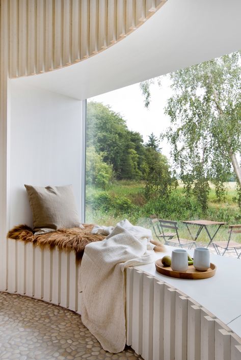 A cosy corner in a Danish holiday home designed by Copenhagen-based architect Jan Henrik Jansen. Photo by Lene K Fotografi via Dezeen. Concrete Bench Seat, Coin Banquette, Social Kitchen, Victorian Terraced House, Plywood Interior, Timber Roof, Kitchen Interiors, Caspar David Friedrich, Built In Seating