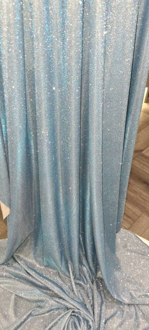 1mtr . baby blue Sparkly moonlight fabric 58 inches  wide  fabric. this is lovely beutifull elegant stretchy moonlight fabric can be used for bridal wear dresses party wear draping crafts and many other things. Mtr price.please note colour may be slightly different from photos due to lighting but it is a beautiful baby blue moonlight colour. Thank you Moonlight Fabric Dresses, Light Blue Party Theme, Light Blue Sparkly Dress, Blue Party Themes, Moonlight Fabric, Light Blue Decor, Baby Blue Fabric, Moonlight Dress, Blue Sparkly Dress