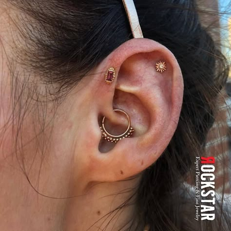 Fresh forward helix from @peterjett_piercingsby ! Jewelry is a Yellow gold Beaded Baguette with Rhodolite, and we also got to spruce up a pre-existing helix with a tiny Sunray holding a White Sapphire - both from @bvla 😍 💎 Daith not performed here... Gold Forward Helix Piercing, Forward Helix Daith, Daith Forward Helix Piercing, Bvla Jewelry Ears, Daith And Forward Helix Piercing, Bvla Daith, Forward Helix Piercing Hoop, Forward Helix Piercing Ideas, Forward Helix Hoop