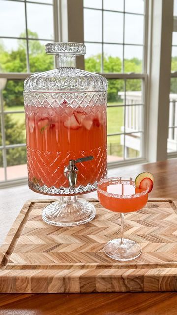 Samantha Bauchmann on Instagram: "STRAWBERRY TEQUILA PUNCH / think of it like a margarita + a strawberry spritzer had a baby, and that’s this cocktail 🥰 light, refreshing & you only have to make one batch for an entire party. INGREDIENTS: 4 cups frozen strawberries 2 cups blanco tequila 1 cup Cointreau 1 cup lime juice 1/2 cup sugar 1 bottle brut sparkling wine / champagne 2 liters sparkling water Salt + sugar for rim Lime wheels + strawberry slices for garnish Ice INSTRUCTIONS: 1) Add frozen strawberries, tequila, cointreau, lime juice and sugar to a blender. Blend thoroughly. Pour contents into a drink dispenser, add sparkling water + sparkling wine/champagne. Add ice, lime wheels & strawberry slices for garnish. 2) When ready to serve, rim edge of glass with a lime wedge and dip into Mocktail Drink Dispenser, Beverage Dispenser Stand Diy, Margarita Dispenser, Sparkling Wine Punch, Strawberry Spritzer, Samantha Bauchmann, Cocktail Dispenser, Sparkling Water Cocktail, Tequila Punch