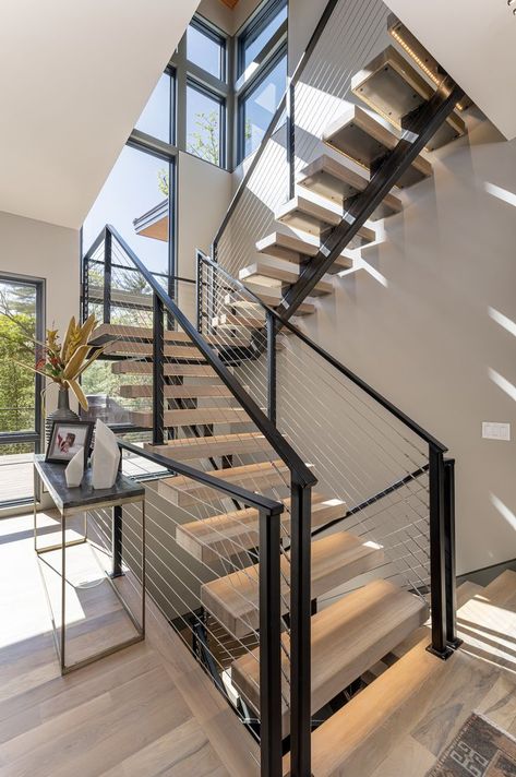 Floating stairs are the perfect first impression piece for new guests. How beautiful is this staircase? ID.ology Interiors and Design can make all of your home dreams come true. We are based out of (but not limited to) Asheville, NC. Check out our website to learn more! Millhaven Homes, Contemporary Staircase, House Staircase, Prairie Style Houses, Floating Staircase, Stair Case, Home Stairs Design, Modern Stairs, Modern Staircase