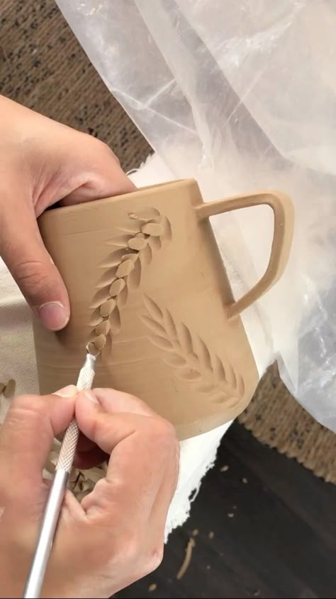 @ceramicvideo @alarasati Carving 🍃 leaf mugs for a commissioned order . . . #indonesiaartist #mugs #carving #claylovers | Instagram Carving On Clay, Flower Carving Clay, Leaf Pottery Ideas, Ceramic Engraving Ideas, Pottery Sgraffito Ideas, Ceramic Bowl Ideas Design, Carving Pottery Ideas Patterns, Cylinder Ceramic Ideas, Mug Clay Designs