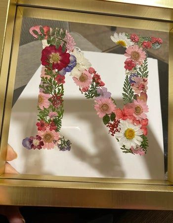 37 Products To Help You Bring Spring Into Your Home Dried Flowers Picture Frame Diy, Frames Pressed Flowers, Pressed Flower Letters, Pressed Flower Letter Art, Pressed Flower Art Picture Frames Wedding Bouquets, Framed Flower Art, Flower Picture Frames, Nursery Monogram, Handmade Personalized Gifts