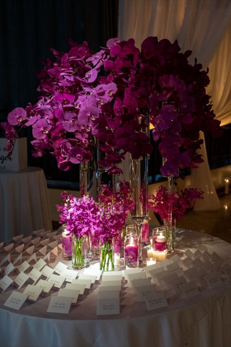 Elegant+Moody purple orchids and floating candlelights escort card table display | tall centerpiece escort card, escort card table display, wedding table decor, wedding inspo, wedding decorating ideas, dream wedding reception, wedding planning ideas, wedding tips, bride to be, glamourous wedding, ballroom wedding, wedding decor, glamorous escort card table, wedding welcome table, wedding decor inspo, wedding decorating ideas, wedding centerpiece ideas, weddings centerpieces elegant | #wedding Welcome Table Wedding, Decorating Ideas Wedding, Wedding Decorating Ideas, Table Wedding Decor, Moody Purple, Wedding Welcome Table, Wedding Ballroom, Dream Wedding Reception, Elegant Wedding Centerpiece