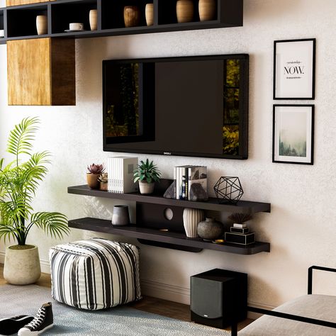 A stunning piece to add to your living space, this wall-mounted shelving unit is a gorgeous media console to feature in a modern home. Small Apartment Tv Wall, Mounted Tv Stand Decor, Loft Tv Room Ideas, Under The Tv Decor, Tv Console Shelves, Decorating Around A Tv On The Wall, What To Put Under Mounted Tv, Couch Shelves, Under Tv Decor