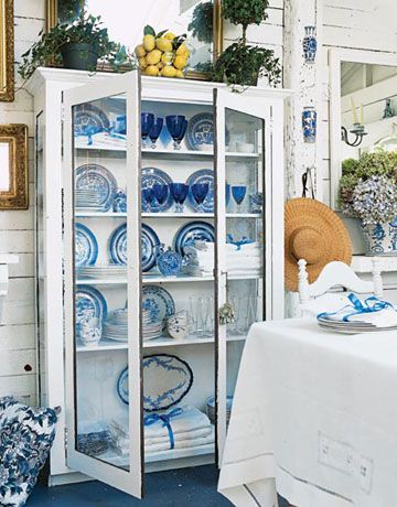 "Medium old" antique plates printed with a Blue Willow pattern are all part of the mix of dinnerware Sally displays with her linens in a glass-doored cabinet, which was made for a beloved uncle in China. He also purchased the 1940s blue stemware — at Woolworth's in downtown San Francisco. White China Cabinets, Blue Stemware, Romantic House, White Hutch, Pantry Space, Blue White Decor, China Cabinets, Blue Transferware, French Kitchen