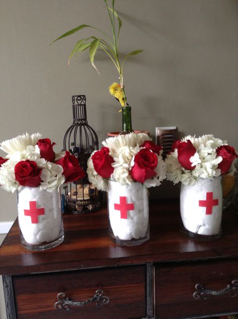 Nurse theme centerpieces by Connie Medical School Graduation Party Ideas, Nurse Grad Parties, Nurse Graduation Party Decorations, Medical Party, Doctor Party, Nursing School Graduation Party, Nurse Party, Medical School Graduation, Graduation Party Centerpieces