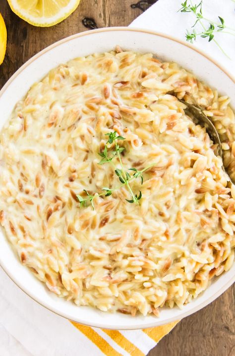 This Creamy Lemon Orzo is a simple and delicious side dish that can be ready in less than 30 minutes. Pairs perfectly with chicken or fish. Creamy Lemon Orzo, Homemade Baileys Irish Cream, 7 Layer Salad, Creamy Orzo, Homemade Baileys, Layer Salad, Risotto Dishes, Make Ahead Salads, Lemon Orzo