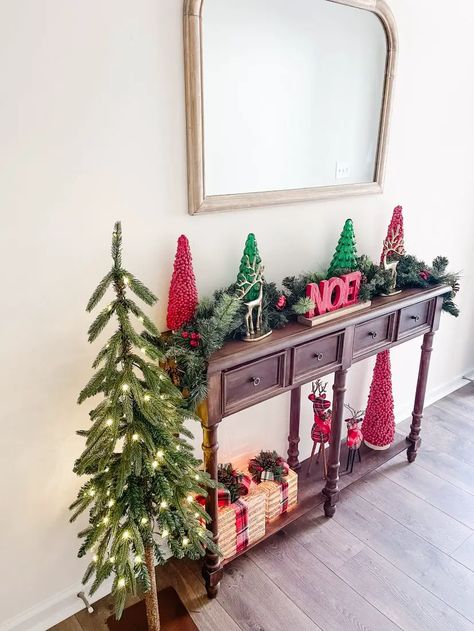 Christmas Console Table - Blogs by Aria Christmas Decor Ideas For Sofa Table, Christmas Decor Sofa Table, Console Table Christmas, Christmas Console Table Decor, Christmas Console Table, Window Garland, Christmas Chandelier, Holiday Bed, Pinecone Garland