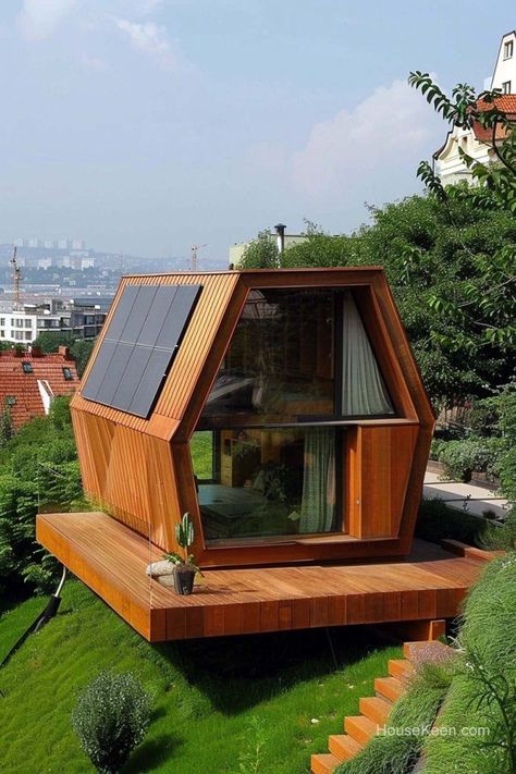 In the heart of the urban jungle stands a unique tiny dwelling, its hexagonal shape a beacon of architectural innovation. Hexagon House, Tiny House Hotel, City Houses, Modular Housing, Modern Cabin, City House, Tiny Home, Tiny House Design, Urban Jungle