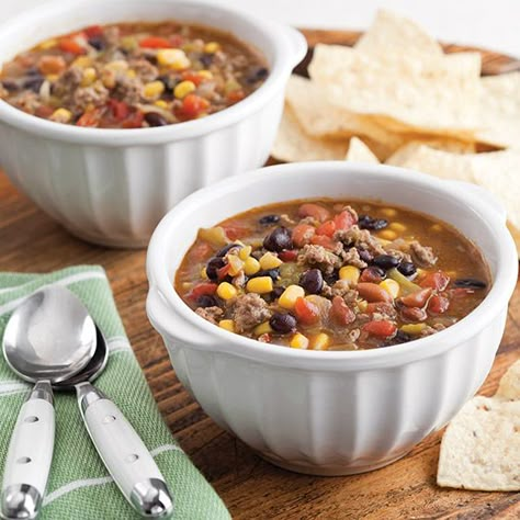 This Taco Soup is a filling combination of beef, black, corn, green chiles, and ranch style bean. Give it some extra flavor with your favorite cheese! Paula Deen Taco Soup, Ranch Style Beans, Black Beans Corn, Paula Deen Recipes, Taco Soup Recipe, Green Enchilada Sauce, Green Chiles, Soup For The Soul, Soup Chili