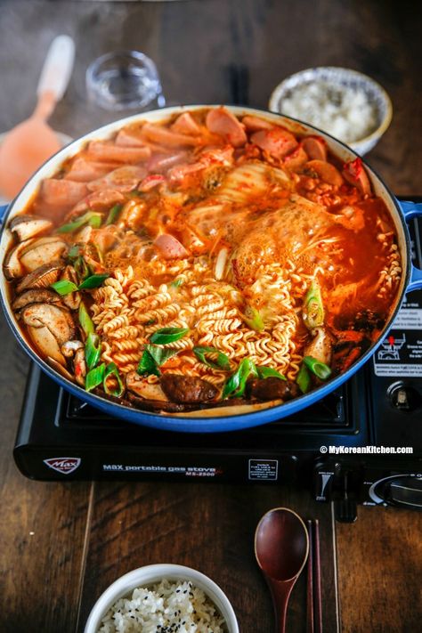 Korean army stew (Budae Jjigae) is a Korean fusion hot pot dish loaded with Kimchi, spam, sausages, mushrooms, instant ramen noodles and cheese. The soup is so comforting and addictive! | MyKoreanKitchen.com Ramen Ideas, Budae Jjigae, Winter Stew, Korean Army, Recipe Korean, Soup Ideas, Korean Kitchen, Ramen Recipe, Lovely Pic